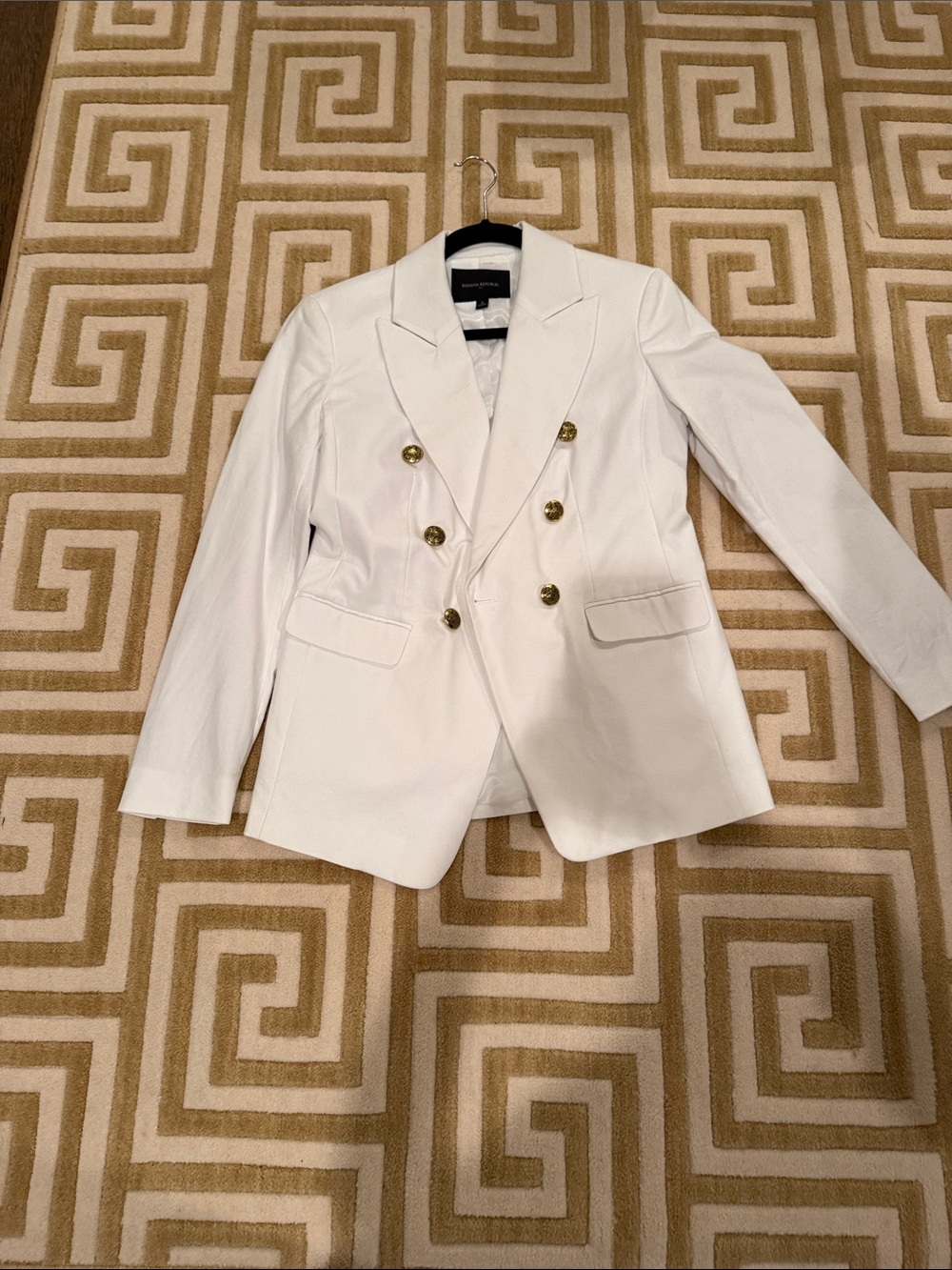 Woman’s Double-Breasted White Blazer with Gold Buttons